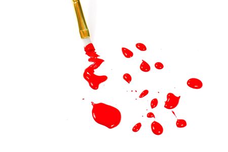 Paint brush with red paint dropsの写真素材