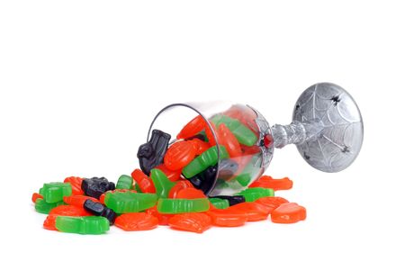spilled glass of halloween candyの写真素材