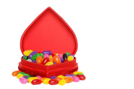 lots of jelly beans in a red heart boxの写真素材