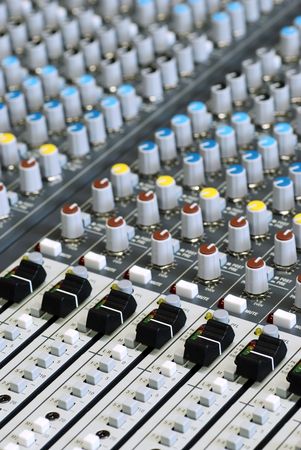 sound board mixer with focus on black sliders