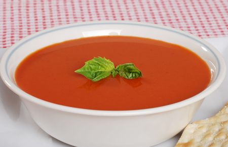 tomato soup with fresh basilの写真素材