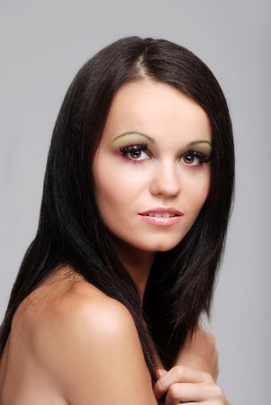 brunette woman with arms across chestの写真素材