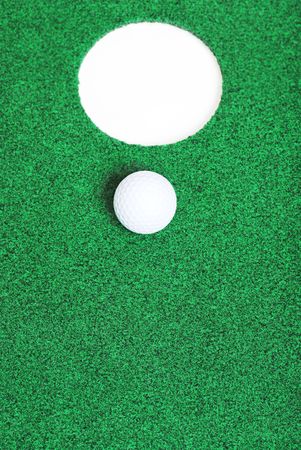 golf ball near the cupの写真素材