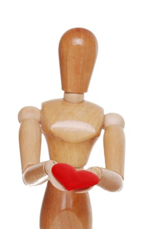 Wood Figure Holding Red Heart Focus Handsの写真素材