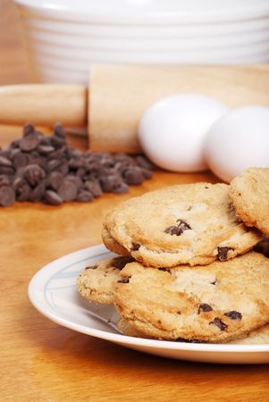 closeup of chocolate chips cookies with ingredientsの写真素材