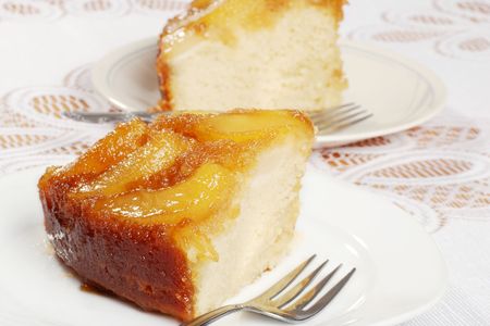 closeup of two slices upside down pear cakeの写真素材