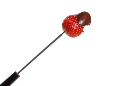 chocolate covered strawberry on fondue stickの写真素材