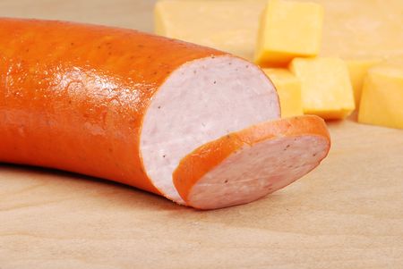kielbasa with cheddar cheese in backgroundの写真素材