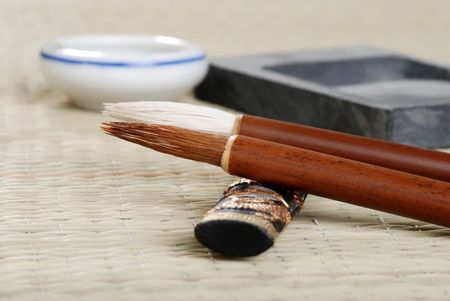 macro asian calligraphy brush with accessoriesの写真素材