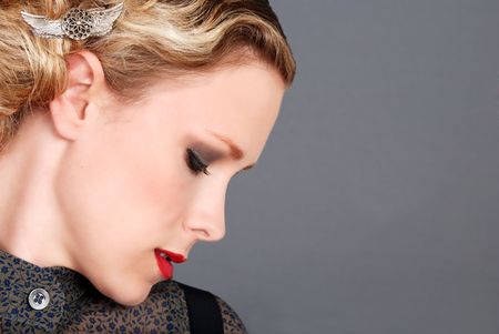 blond woman with red lipstick side profile