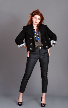 young red head with hands on her hipsの写真素材