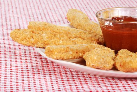 chicken fingers focus on bowlの写真素材