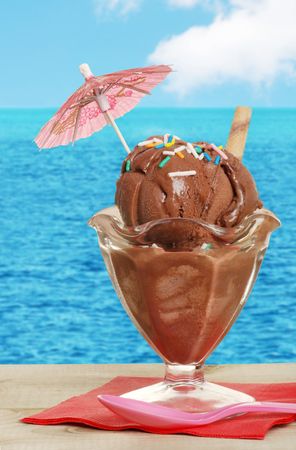chocolate sundae with sprinkles on wood tableの写真素材