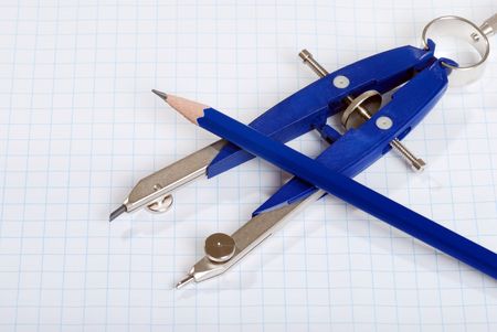 compass and pencil on graph paperの写真素材
