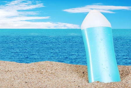 closeup of suntan lotion on the beachの写真素材
