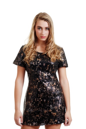 blond teenager wearing black and gold dressの写真素材