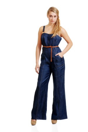 young female teenager in jeans jumpsuitの写真素材