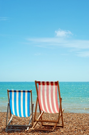two deck chairs on the beachの写真素材