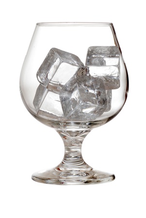 isolated brandy glass with ice cubesの写真素材