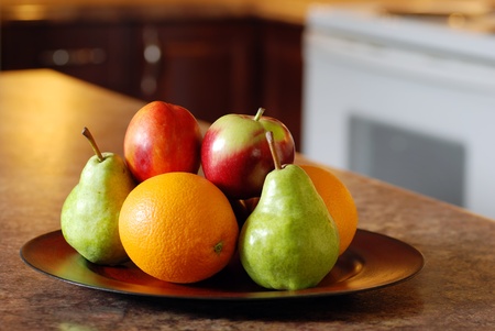 mixed fruit on wood plateの写真素材