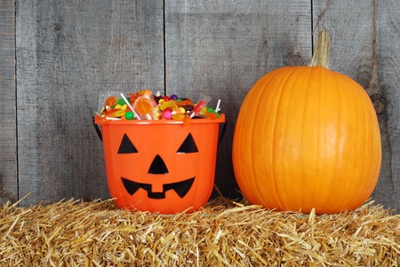 Halloween candy in pumpkin bucketの写真素材