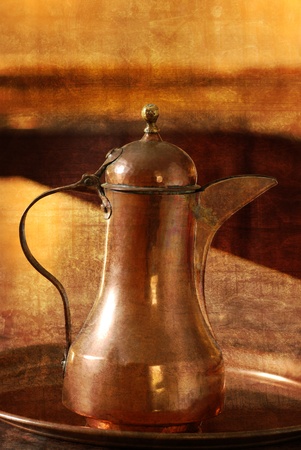 Antique copper jug with grunge backgroundの写真素材