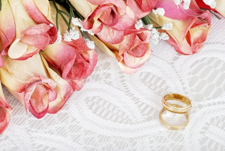 wedding bands with bunch of rosesの写真素材