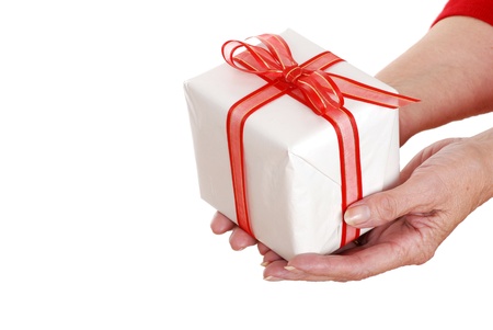Senior woman hands holding christmas giftの写真素材