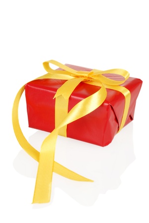 red christmas present with yellow bowの写真素材