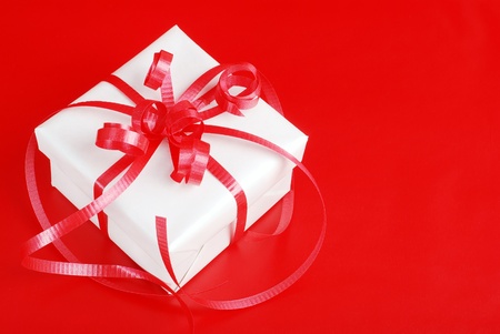 White christmas present on redの写真素材