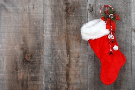 Christmas sock and wreath on woodの写真素材