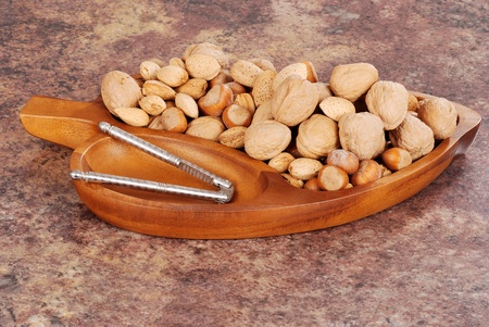 Mixed nuts in a wood bowlの写真素材