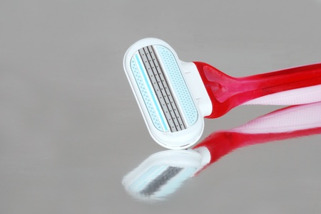Woman razor with reflection