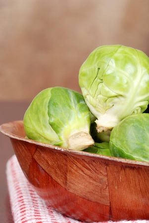 Brussel sprouts in wood bowlの写真素材