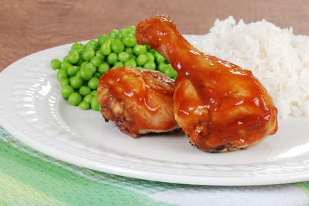 chicken legs with peas and riceの写真素材