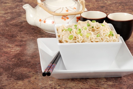 Asian noodles with tea pot and cupsの写真素材