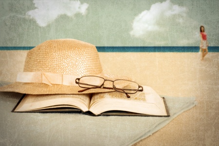 Vintage beach with book and hatの写真素材