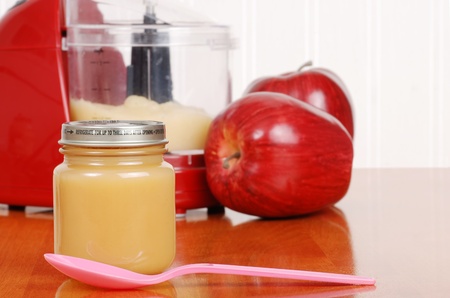 homemade apple sauce baby food with spoonの写真素材