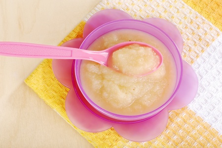 Top view apple sauce in baby bowlの写真素材
