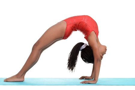 South African child doing gymnastics bridgeの写真素材