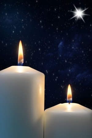 Two candles with Star of Bethlehemの写真素材