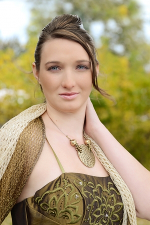 Portrait teen girl in fancy dress outdoorsの写真素材
