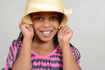African Girl being silly with hatの写真素材