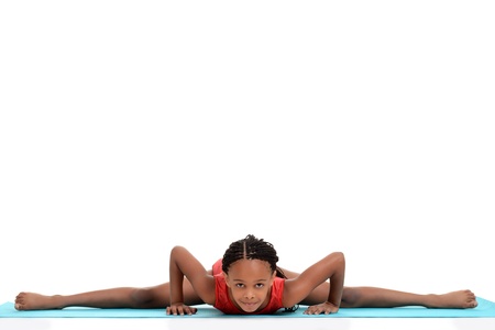 young girl doing gymnastics front splitの写真素材