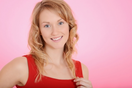 blond woman playing with her hairの写真素材