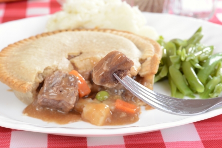 Steak pie on a forkの写真素材