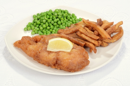 Fried fish with slice of lemonの写真素材