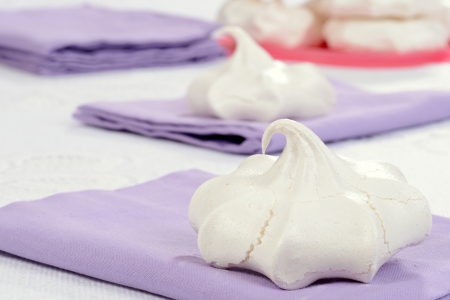 meringue cookie on lavendar napkinの写真素材