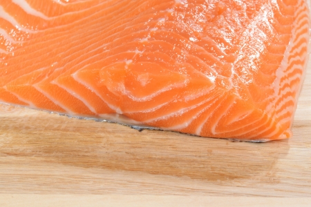 fresh raw salmon on woodの写真素材