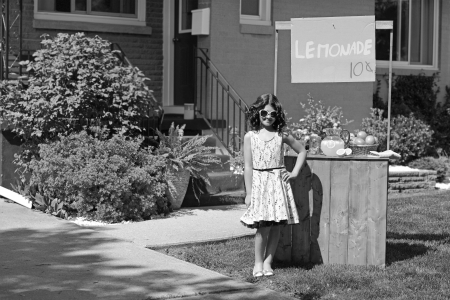 vintage girl with lemonade standの写真素材